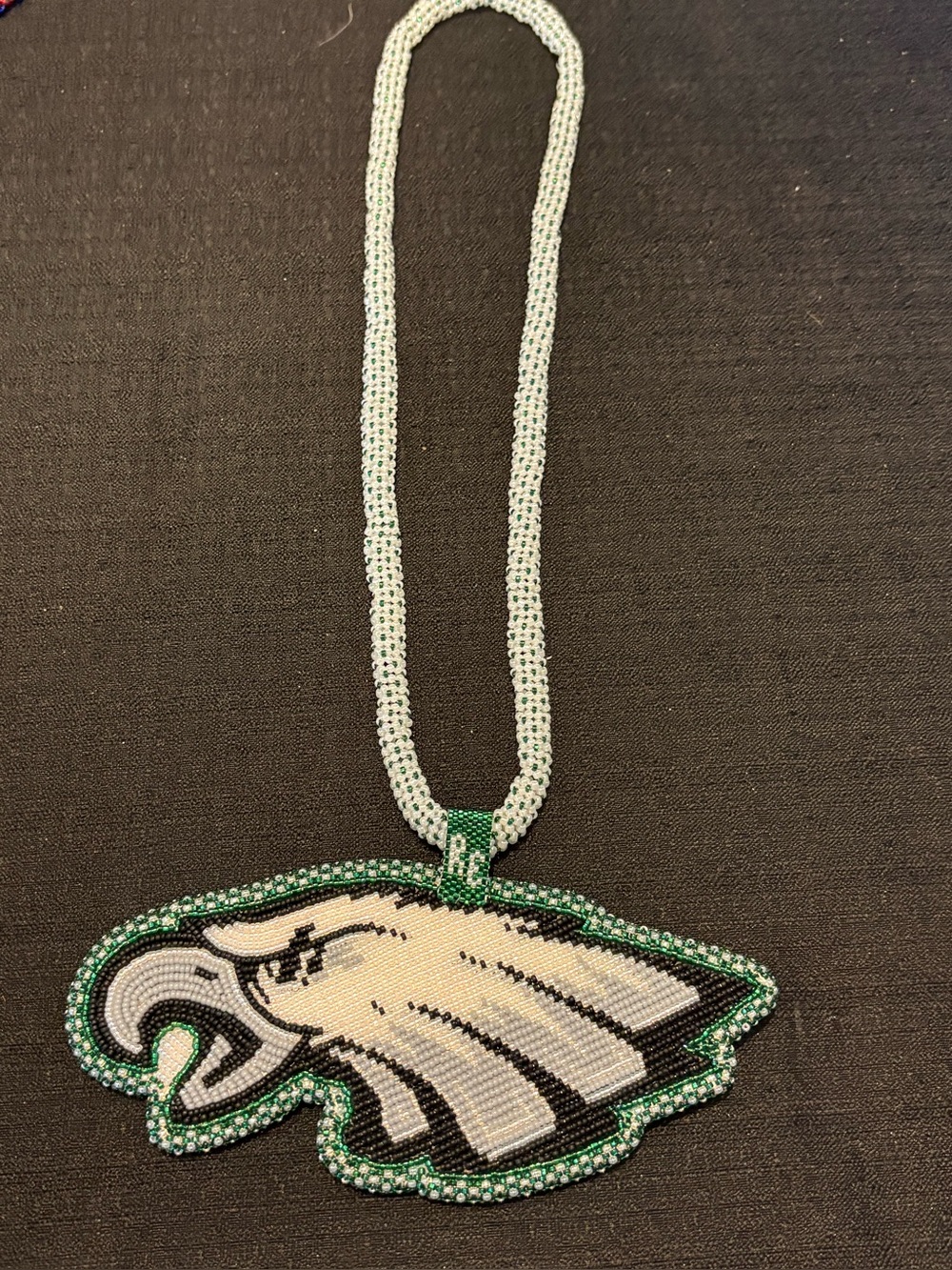 Handmade beaded medallion Philadelphia Eagles (initials “RE” on it